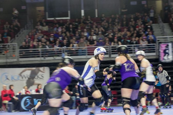 The Rose City Rollers of Portland, Oregon, face off against the Victorian Roller Derby League from Melbourne, Australia, in the championship game at the WFTDA International Championships at the Liacouras Center. (Brad Larrison for WHYY)