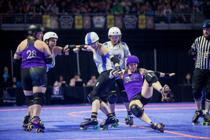 The Rose City Rollers of Portland, Oregon, face off against the Victorian Roller Derby League from Melbourne, Australia, in the championship game at the WFTDA International Championships at the Liacouras Center. (Brad Larrison for WHYY)