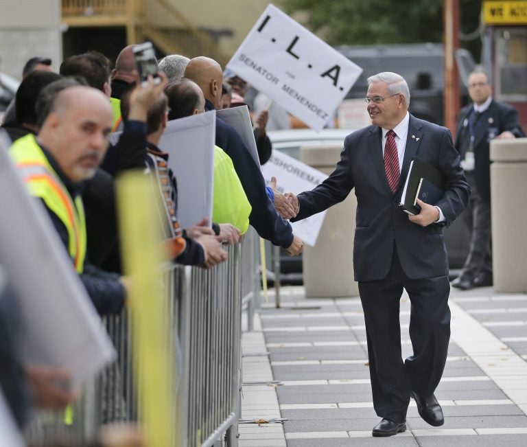 U.S. Sen. Bob Menendez greets supporters as he arrives to court in Newark, N.J., last month. (Seth Wenig/AP Photo)