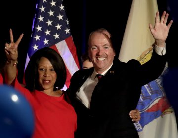 New Jersey Governor Elect Phil Murphy, right, and Lt. Gov. Elect Sheila Oliver wave to supporters