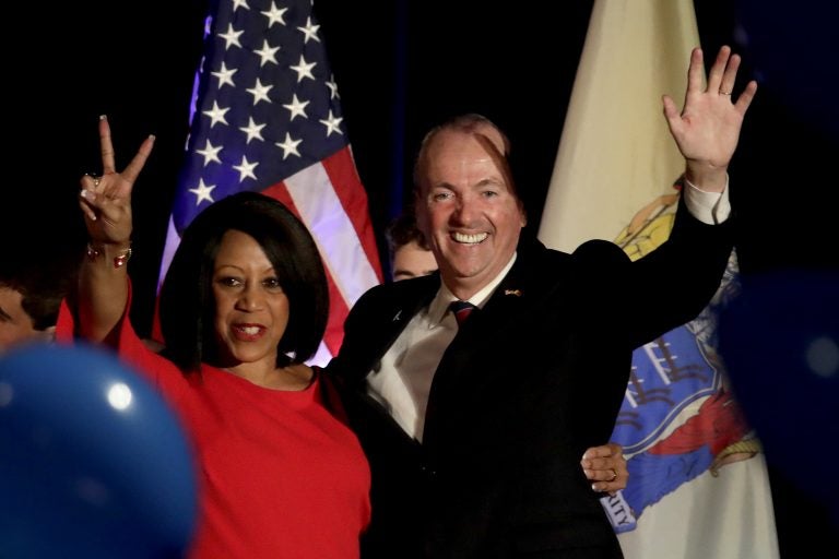 New Jersey Governor Elect Phil Murphy, right, and Lt. Gov. Elect Sheila Oliver wave to supporters