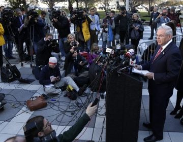Democratic Sen. Bob Menendez speaks to reporters in front of the courthouse in Newark, N.J., Thursday, Nov. 16, 2017. The federal bribery trial of Menendez ended in a mistrial Thursday when the jury said it was hopelessly deadlocked on all charges against the New Jersey politician and a wealthy donor.