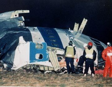 FILE - In this Dec. 21, 1988, file photo, rescue workers examine the nose of Pan Am Flight 103 near the town of Lockerbie, Scotland, after a bomb aboard exploded, killing a total of 270 people. Families of some of the 270 people who died in the airliner bombing 25 years ago gathered for memorial services Saturday, Dec. 21, 2013, in the United States and Britain, honoring victims of the terror attack that killed dozens of American college students and created instant havoc in the Scottish town where wreckage of the plane rained down.