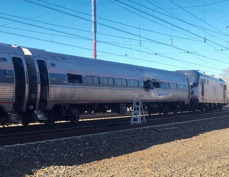 This photo shows an Amtrak train following a crash Sunday, April 3, 2016, in Chester, Pa. Amtrak said the train was heading from New York to Savannah, Ga., when it struck a backhoe outside of Philadelphia. (Glenn R. Hills Jr via A