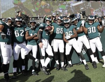 Philadelphia Eagles' Zach Ertz (86) poses with teammates after scoring a touchdown during the first half of an NFL football game against the Chicago Bears, Sunday, Nov. 26, 2017, in Philadelphia. (Michael Perez/AP Photo)