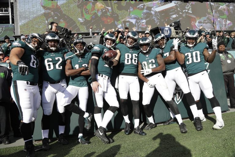 Philadelphia Eagles' Zach Ertz (86) poses with teammates after scoring a touchdown during the first half of an NFL football game against the Chicago Bears, Sunday, Nov. 26, 2017, in Philadelphia. (Michael Perez/AP Photo)