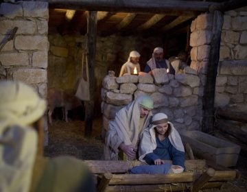 In this Tuesday, Dec. 22, 2015 file photo, Christian actors play the parts of Joseph and Mary during a re-enactment of a Nativity scene of the birth of Jesus Christ as part of Christmas festivities at the Nazareth Village in the northern Israeli city of Nazareth. (Ariel Schalit/AP Photo, file)