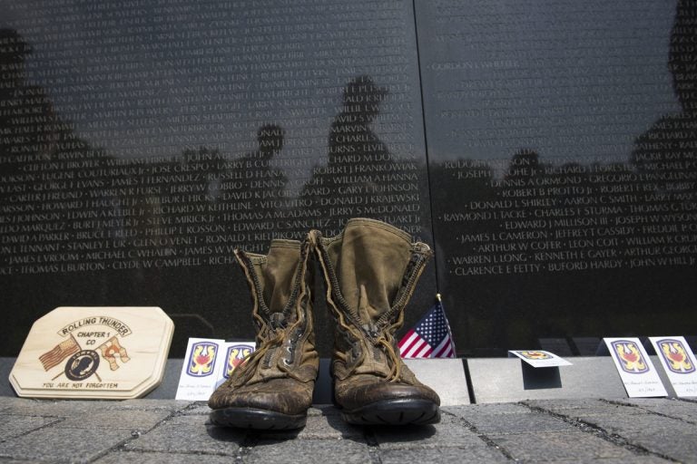 A pair of military boots are left at the Vietnam Veterans Memorial during the 30th anniversary of the Rolling Thunder 'Ride for Freedom' demonstration in Washington, Sunday, May 28, 2017. (Cliff Owen/AP Photo)