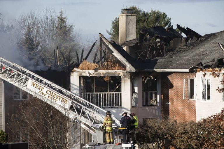 Firefighters continue to work the scene of a fire at the the Barclay Friends Senior Living Community in West Chester, Pa., Friday, Nov. 17, 2017. (