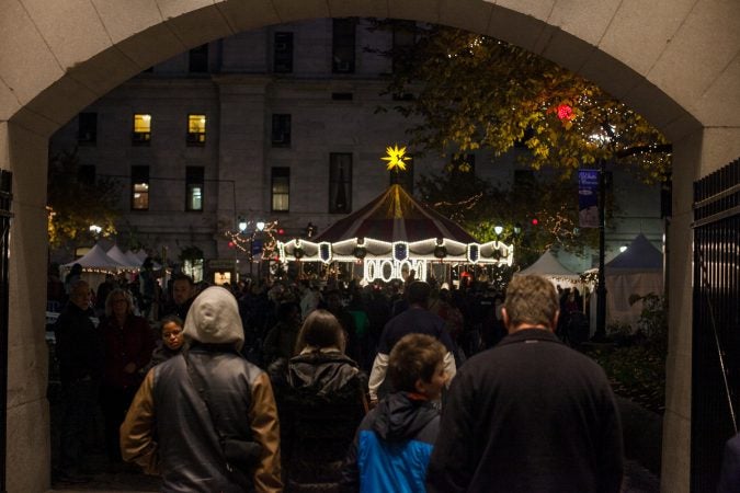 A carousel installed in the City Hall courtyard for the Christmas Village. (Brad Larrison for WHYY)