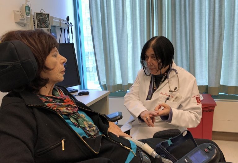 Dr. Terry Heiman-Patterson meets with Pat Vitkow, a patient with ALS. (Joel Wolfram for WHYY)