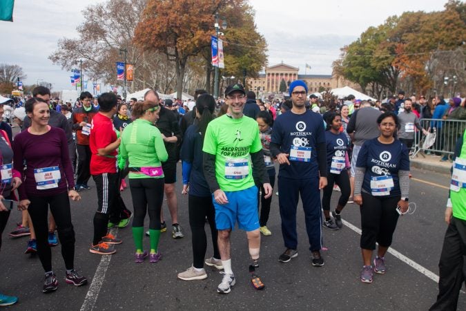 Evan Freiberg waits to begin the Rothman Institute 8k Saturday. The 43-year-old is diagnosed with leiomyosarcoma, a form of cancer, and competed after losing the bottom portion of his left leg to the disease. (Brad Larrison for WHYY)