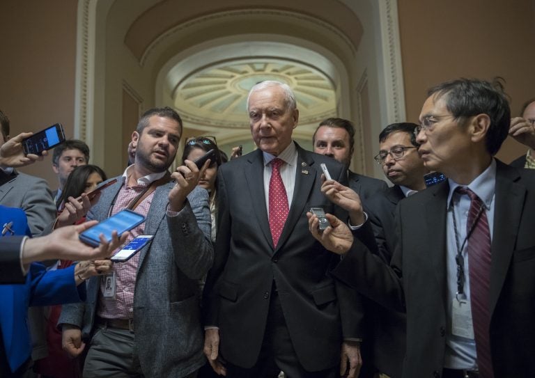 Senate Finance Committee Chairman Orrin Hatch, R-Utah, surrounded by reporters in the U.S. Capitol. The committee will hold its hearing on its tax bill next week. Senators aim to pass it out of committee before the Thanksgiving holiday.
(J. Scott Applewhite/AP)