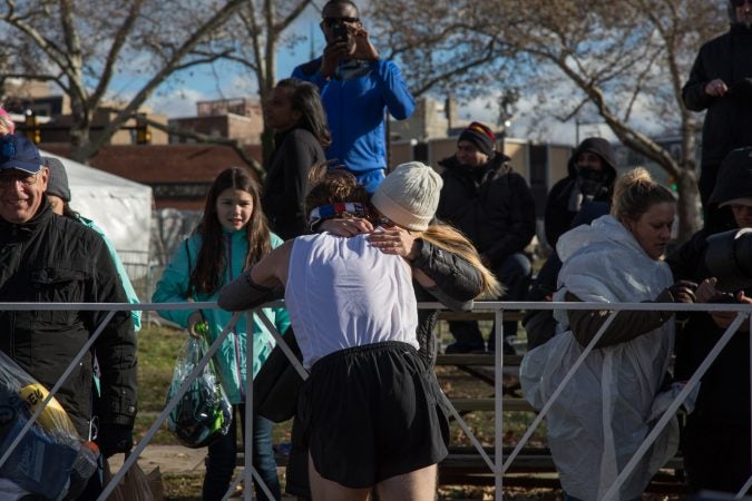 John Bleday, 26, hugs his girlfriend after finishing 9th overall at the 23rd annual Philadelphia Marathon on Sunday, November 19th, 2017.