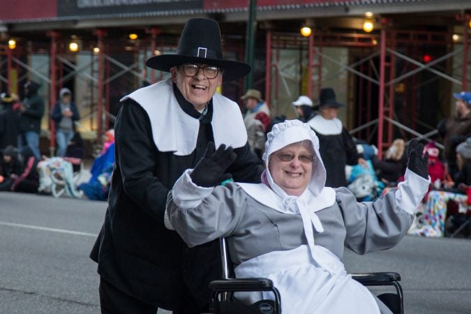 A couple dresses up as pilgrims to march in the 98th annual Philadelphia Thanksgiving Day Parade, November 23, 2017. (Emily Cohen for WHYY)