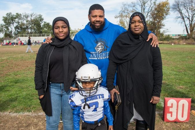 Rickey Duncan stands with his wife, Zahira, and his children, step-daughter, Rabi'ah, 15, and son, Zaid, 4.