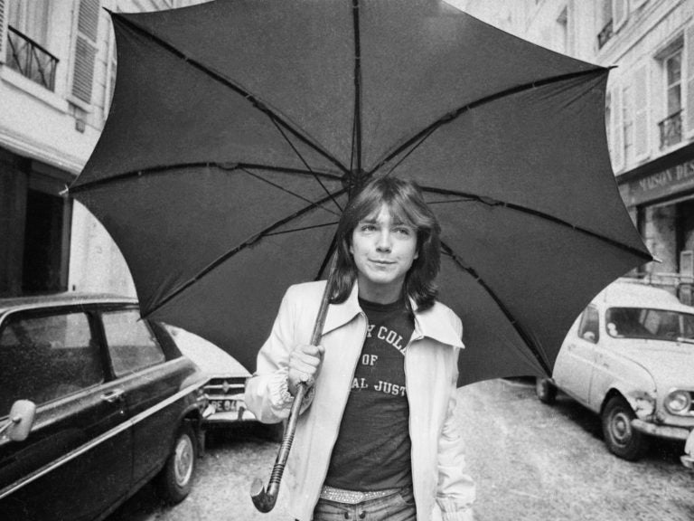 David Cassidy walks down a street in London in April 1974.
