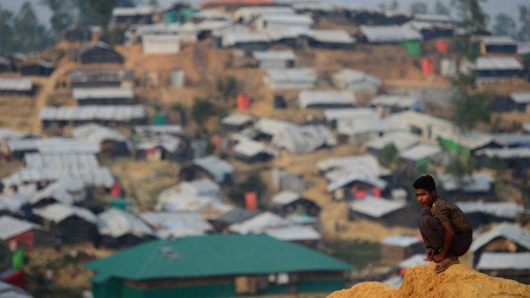 A Rohingya refugee boy looks on at Balukhali refugee camp in the Bangladeshi district of Ukhia on Wednesday. An estimated 618,000 Muslim Rohingya have fled mainly Buddhist Myanmar since a military crackdown was launched in Rakhine in August. Refugees describe a campaign of rape, murder and arson.
A Rohingya refugee boy looks on at Balukhali refugee camp in the Bangladeshi district of Ukhia on Wednesday. An estimated 618,000 Muslim Rohingya have fled mainly Buddhist Myanmar since a military crackdown was launched in Rakhine in August. Refugees describe a campaign of rape, murder and arson. (Munir Uz Zaman/AFP/Getty Images)