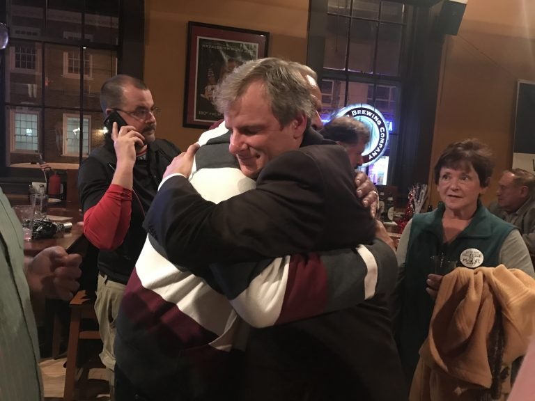 York City Council President Michael Helfrich, a Republican, embraces a supporter after winning the mayor's race. (Emily Previti/WITF)