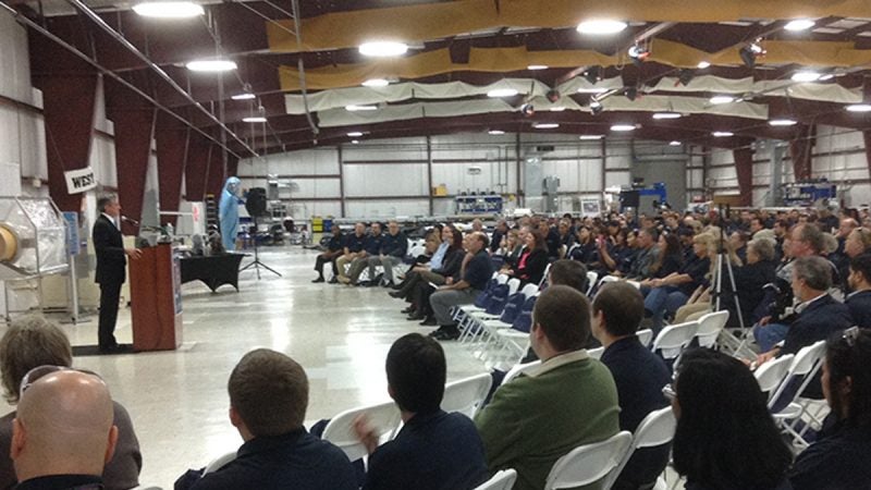 Gov. John Carney talks to employees at ILC Dover as the company celebrates its 70 year anniversary. (Zoë Read/WHYY)