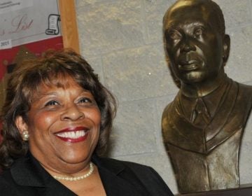 Wilma Mishoe has been named the first permanent female president of Delaware State University. She has been interim president since January. The bust next to her is of her father Luna, who was the school's president from 1960 to 1987. 
