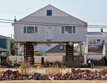 An Ortley Beach bungalow is raised. (Emma Lee/WHYY)