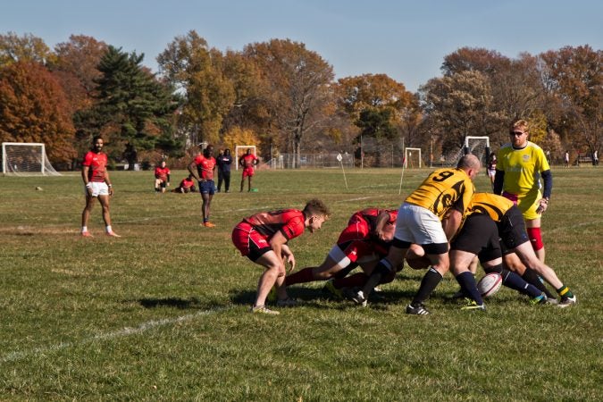 The Rogue Samurai Men battle the Hazbro Blazers at the Apple Pie 7s Rugby Tournament in Fairmount Park. (Kimberly Paynter/WHYY)