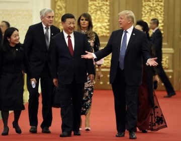 U.S. President Donald Trump and Chinese President Xi Jinping arrive for a state dinner at the Great Hall of the People