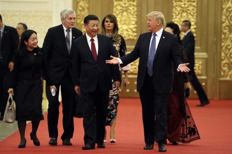 U.S. President Donald Trump and Chinese President Xi Jinping arrive for a state dinner at the Great Hall of the People