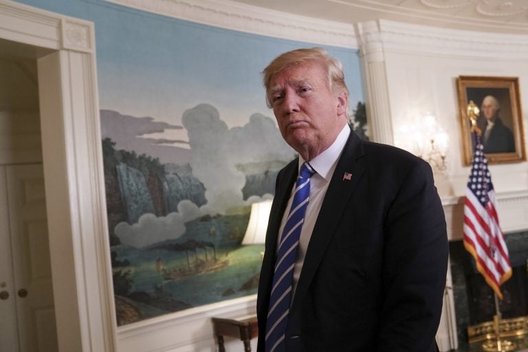 President Donald Trump walks away from the podium after speaking in the Diplomatic Reception Room of the White House