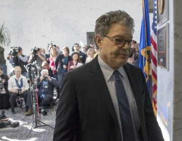 Sen. Al Franken, D-Minn., returns to his office after talking to the media on Capitol Hill in Washington