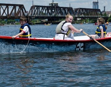 Children row in a Philadelphia Waterborne boat on the Schuylkill River