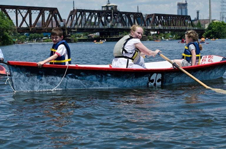 Children row in a Philadelphia Waterborne boat on the Schuylkill River