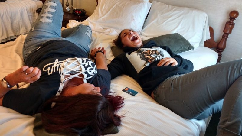 Redina Rodriguez and her daughter, Jordyn share a laugh during a reunion at a hotel in Williamsport, Pennsylvania. (Katie Colaneri/WHYY)