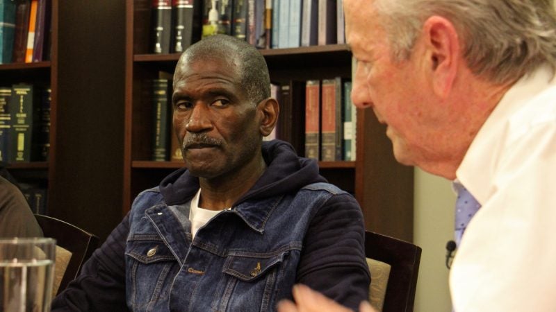 Kevin Brinkley (left) listens to an apology from attorney Gerald Dugan, who 40 years ago prosecuted the murder case that got Brinkley a life sentence. Dugan has since changed his mind about Brinkley's role in the murder of Charles Haag. (Emma Lee/WHYY)