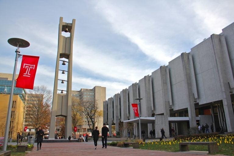 Students walk past Samuel Paley Library on the Temple University campus, where a student died of a drug overdose on Dec. 1.