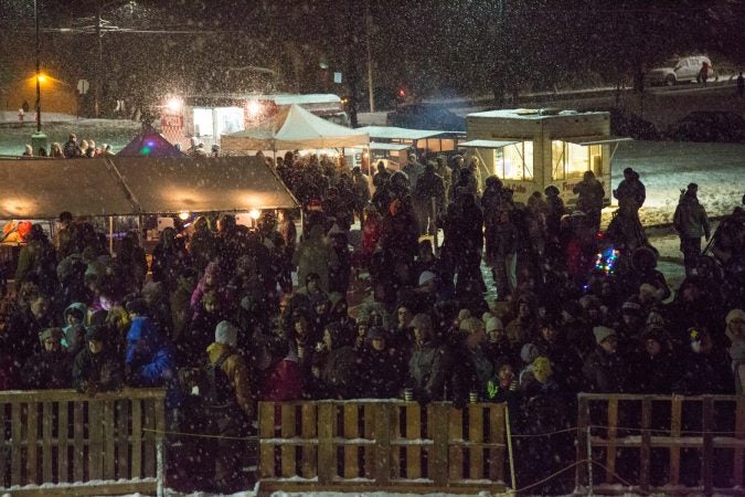 About a thousand spectators gather to watch the 30-foot-tall wooden phoenix set ablaze at the 14th Annual Firebird Festival in Phoenixville. (Emily Cohen for WHYY)