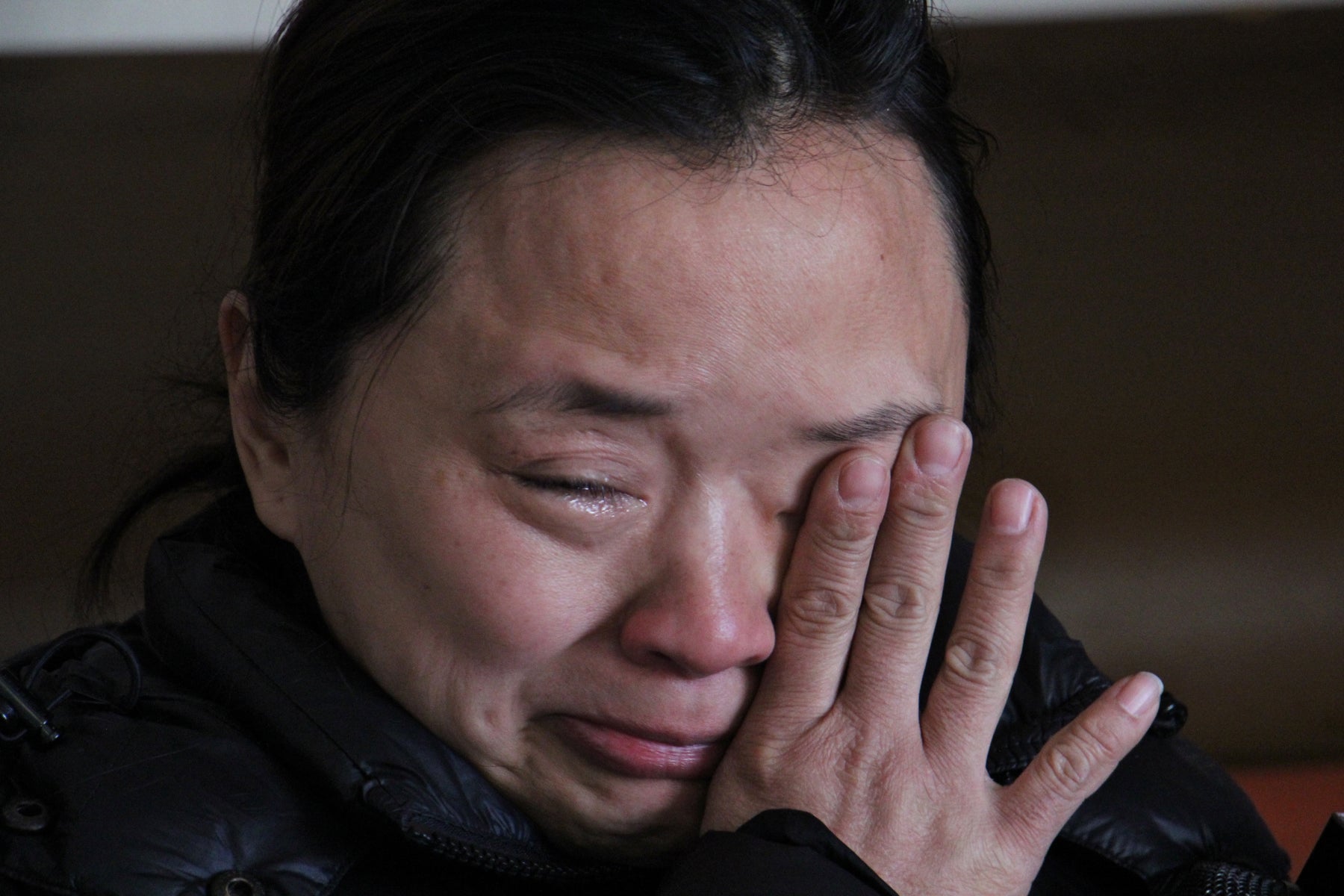 Stop-and-go owner Michelle Tran fights back tears at the thought of losing her plexiglass protection.