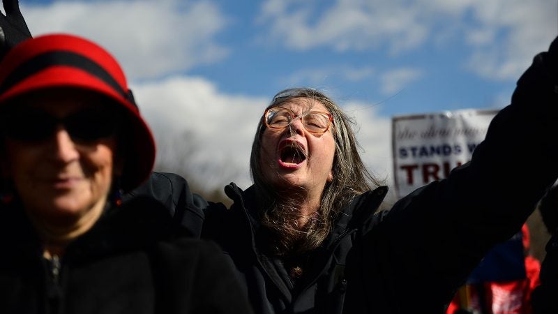 A women praisies President Trump during a prayer as hundreds attend a pro-Trump rally hosted by People4Trump, in Bensalem, Pennsylvania, on March 4, 2017. (Bastiaan Slabbers for NewsWorks)