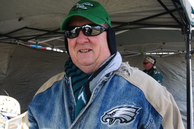 The twenty-five year old jacket worn by Greg Buchanan serves as his lucky charm as he sets up to tailgate with friends and family ahead of the Raiders vs. Eagles Christmas Day game, at the Lincoln Financial Field.