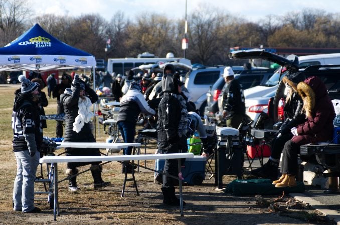 Raiders fans set up to tailgate ahead of the Raiders vs. Eagles Christmas Day game, at the Lincoln Financial Field, on Monday.