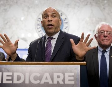 Sen. Cory Booker and Sen. Bernie Sanders speak during a news conference on Capitol Hill in Washington to unveil their Medicare for All legislation to reform health care.