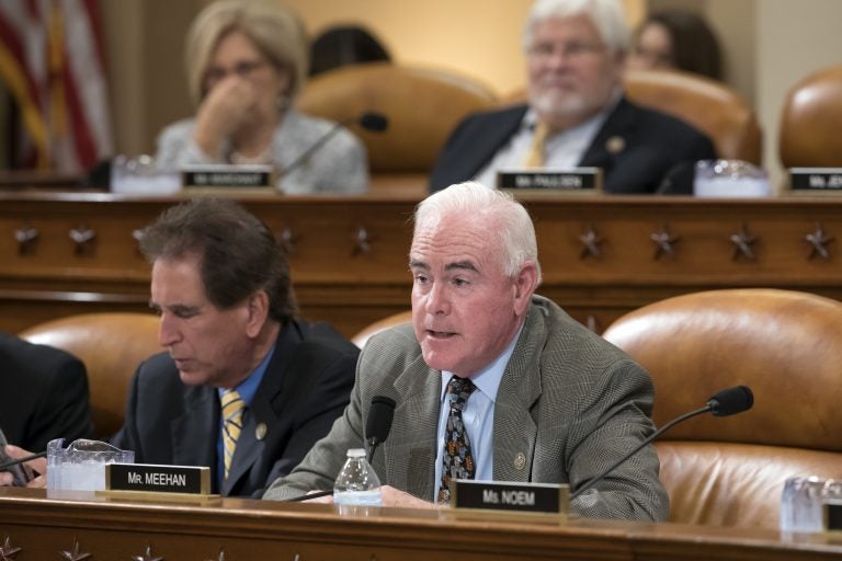 Rep. Pat Meehan, R-Pa., with Rep. Jim Renacci, R-Ohio, left, work on the markup of the GOP's far-reaching tax overhaul, on Capitol Hill in Washington, Monday, Nov. 6, 2017.