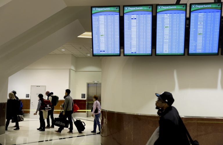 Travelers enter the security line at Hartsfield-Jackson Atlanta International Airport ahead of the Thanksgiving holiday in Atlanta, Wednesday, Nov. 22, 2017. (AP Photo/David Goldman)