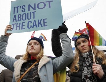 Lydia Macy, 17, left, and Mira Gottlieb, 16, both of Berkeley, Calif., rally outside of the Supreme Court which is hearing the 'Masterpiece Cakeshop v. Colorado Civil Rights Commission' today, Tuesday, Dec. 5, 2017, in Washington.