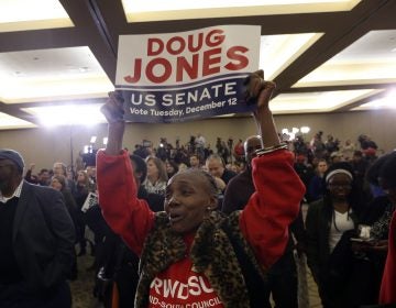 A supporter of Democratic candidate for U.S. Senate Doug Jones what for results during an election-night watch party Tuesday, Dec. 12, 2017, in Birmingham , Ala. Jones defeated Republican Roy Moore.