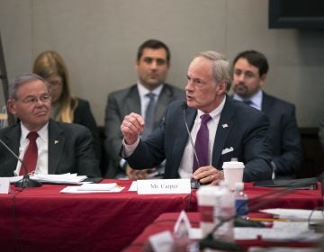 Sen. Tom Carper, D-Del., joined at left by Sen. Bob Menendez, D-N.J., objects strongly to the procedures as tax bill conferees gather to work on the sweeping GOP plan, on Capitol Hill in Washington, Wednesday, Dec. 13, 2017. (AP Photo/J. Scott Applewhite)