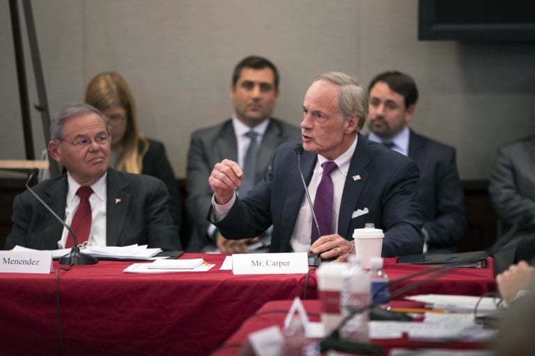 Sen. Tom Carper, D-Del., joined at left by Sen. Bob Menendez, D-N.J., objects strongly to the procedures as tax bill conferees gather to work on the sweeping GOP plan, on Capitol Hill in Washington, Wednesday, Dec. 13, 2017. (AP Photo/J. Scott Applewhite)