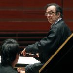 In 2011, world-renowned conductor Charles Dutoit performs with the Philadelphia Orchestra during a rehearsal in Philadelphia. Four women have accused Dutoit of sexual misconduct that allegedly occurred on the sidelines of rehearsals or performances with some of America's great orchestras. The 81-year-old is the artistic director and principal conductor at London's Royal Philharmonic Orchestra and conductor laureate of the Philadelphia Orchestra.   (AP Photo/Alex Brandon, File)