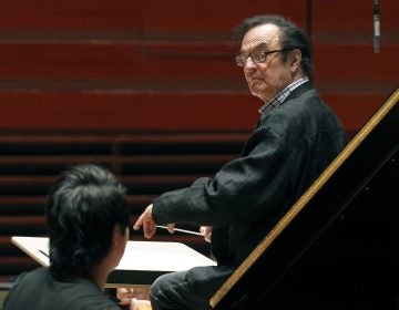 In 2011, world-renowned conductor Charles Dutoit performs with the Philadelphia Orchestra during a rehearsal in Philadelphia. Four women have accused Dutoit of sexual misconduct that allegedly occurred on the sidelines of rehearsals or performances with some of America's great orchestras. The 81-year-old is the artistic director and principal conductor at London's Royal Philharmonic Orchestra and conductor laureate of the Philadelphia Orchestra.   (AP Photo/Alex Brandon, File)